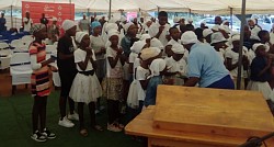 Children prayer session was held inside the big white tent in Pella.