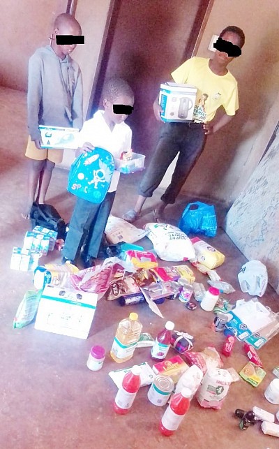 The boy (center) with some of the things donated Praised and Salvation Foundation…